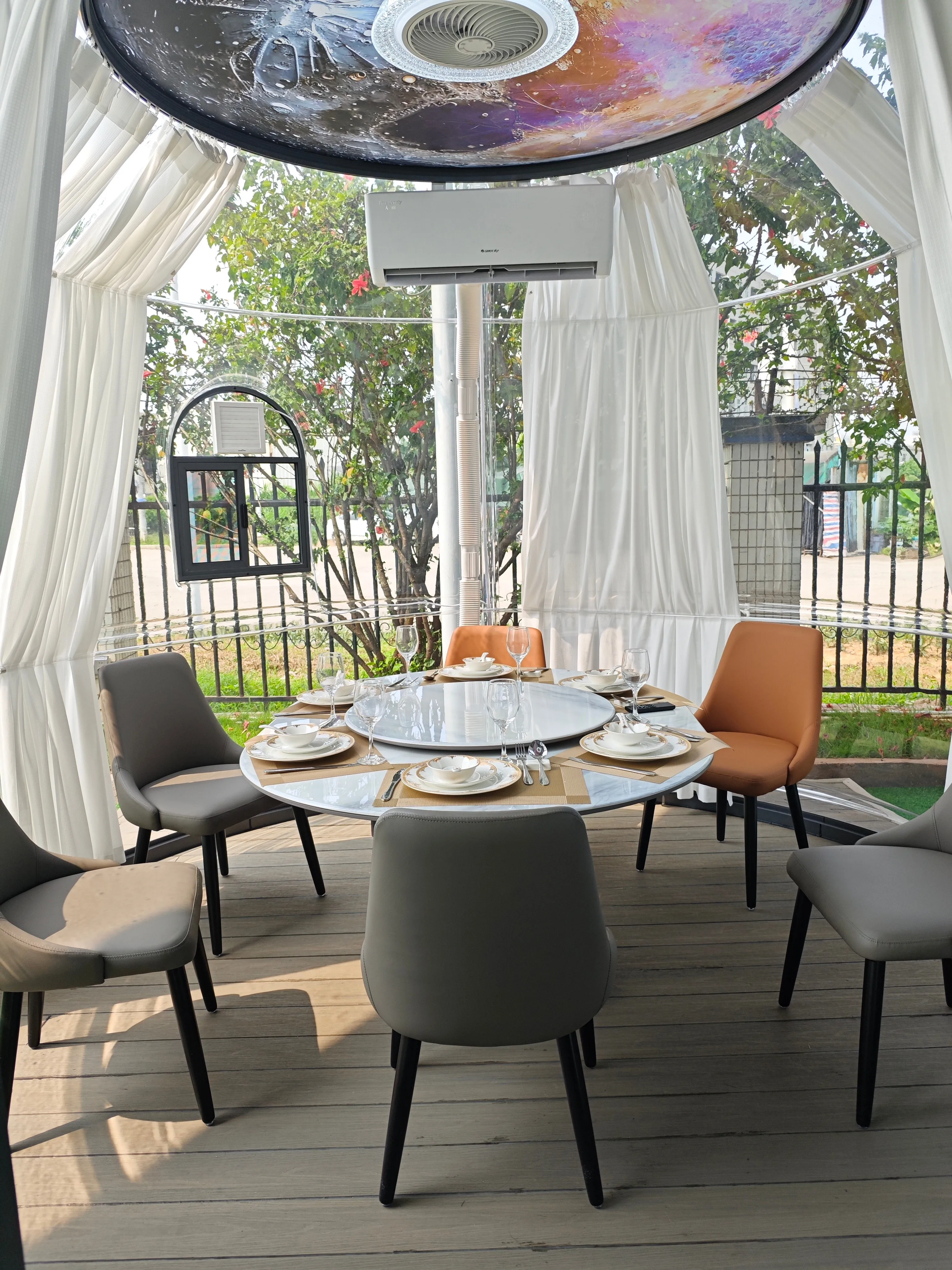 Transparent dome restaurant interior with panoramic dining tables